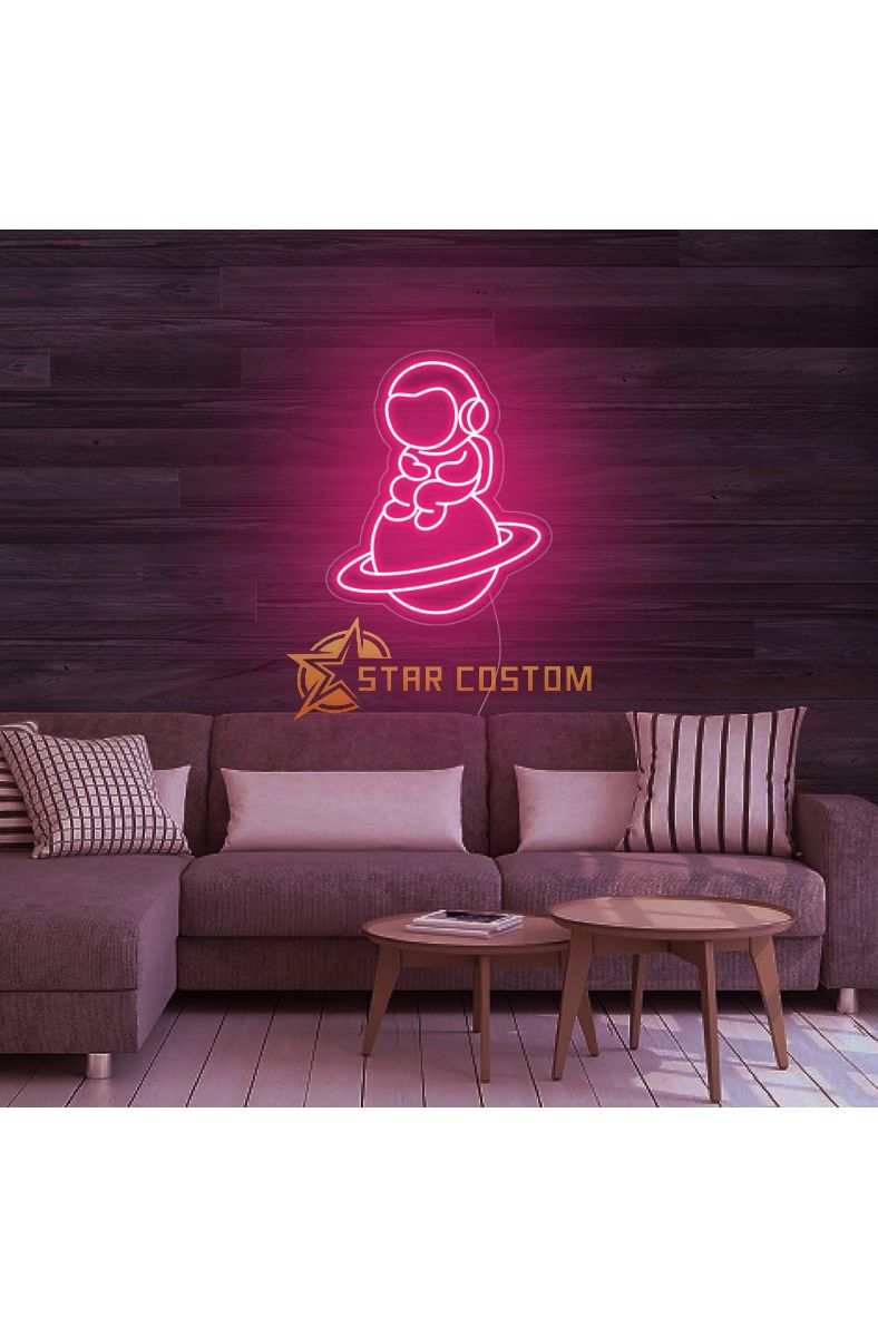 Astronaut Sitting on Planet Neon Sign